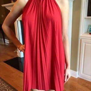 Red pleated high neck tie back dress. Swing dress